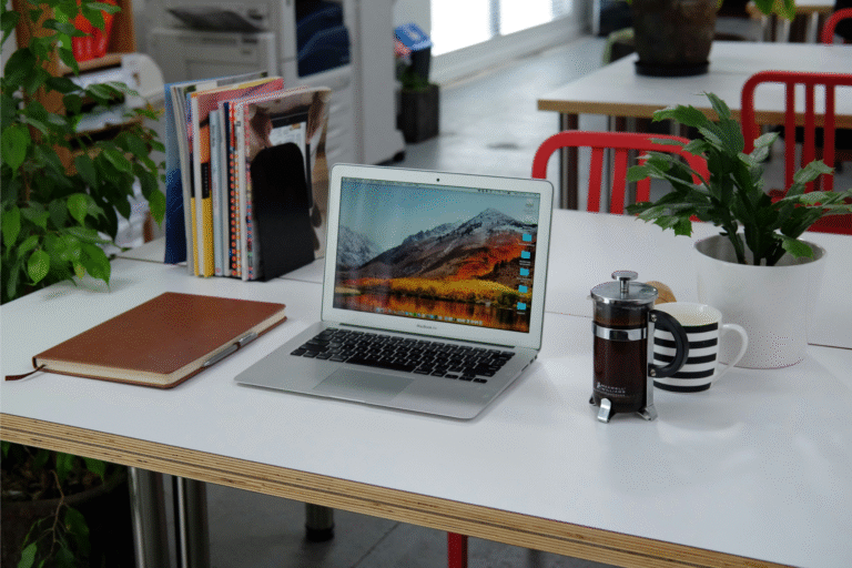 Digital nomad working on Notion at a cozy travel café