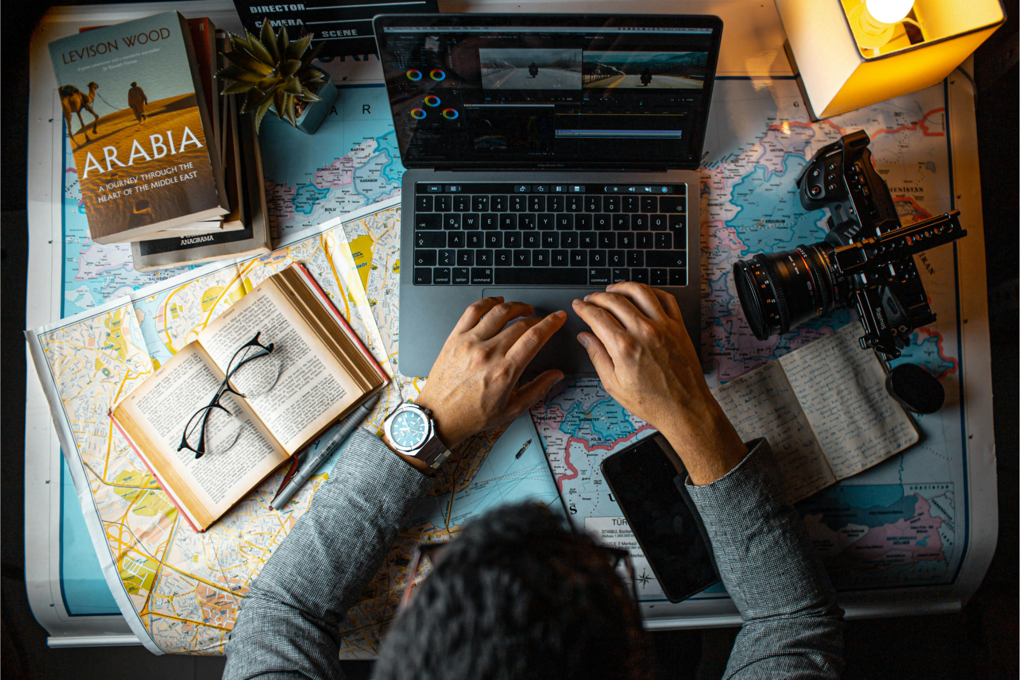 A digital nomad planning travel on a world map